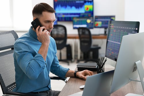 financial-trading-specialist-talking-on-phone-in-o-2026-02-24-20-06-16-utc financial-trading-specialist-talking-on-phone-in-o-2026-02-24-20-06-16-utc
